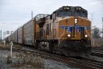 Eastbound vehicle train comes over the diamonds